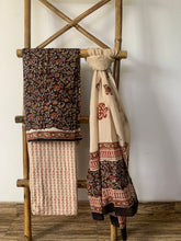 Load image into Gallery viewer, Black and brown block printed cotton kurta set with beige dupatta that has floral block print on it.