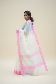 Load image into Gallery viewer, Woman Wearing White Handloom Kota Doria Saree with Pink Border