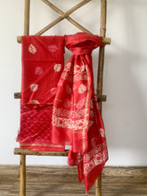 Load image into Gallery viewer, Red kurta is paired with matching bottom and dupatta. The kurta set has delicate block print details on it. 
