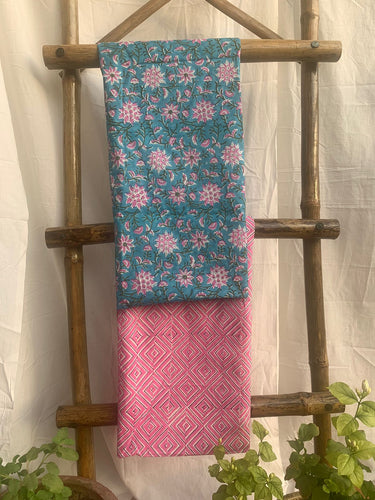 Blue kurta with pink floral details is paired with pink geometric print cotton bottom