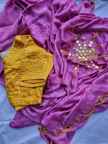 Onion pink bandhani saree with yellow embroidered mirror work and yellow gota blouse