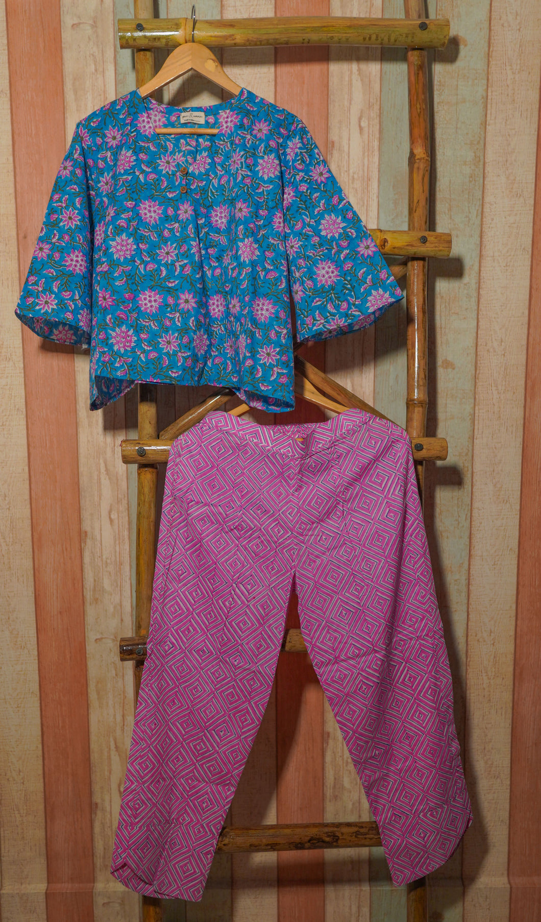 Cotton coord set that comes with a floral print top and pink pants