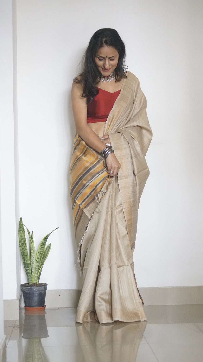 Handloom Sari in beige with multi color pallu and comes with a blouse piece