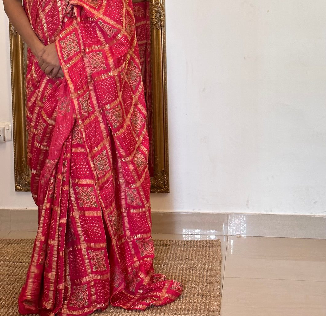 Pink Gharchola Bandhani Block Printed Sari paired with a contrasting green blouse. 