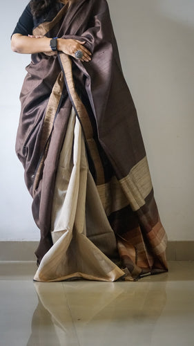 Multicolored Tussar Silk Saree with Brown and Beige as prominent colors. The handloom silk sari comes with a blouse piece