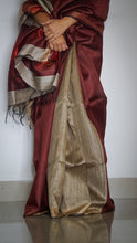 Load image into Gallery viewer, Handloom Silk Sari in wine &amp; beige is curated from the silk city, Bhagalpur. The graceful sari has an effortless drape and comes with tassels on the pallu.
