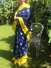 Load image into Gallery viewer, Pochampally Ikkat Saree in blue features yellow border and pallu.
